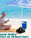 Man sitting on beach with blue stripe umbrella using Heavy Duty Beach Umbrella Base Weight Set With Fillable Sand Bags 4 Sided Anchor.