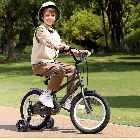 Child riding a bike with Heavy Duty Training Wheels For Kids Bikes 12 To 20 Inch With Stabilizers, Steel Support Arms.