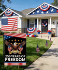 Patriotic Garden Flag Celebrating 250 Years Of Freedom With Eagle Design For Fourth Of July Double Sided Waterproof 12 By 18 Inch USA Flag Banner For Lawn Or Yard Decor displayed in front of a decorated house.