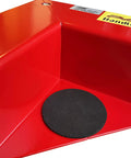 Close-up of a red heavy duty low profile furniture dolly, with a black rubber base, part of the set of 4 with quiet PU rollers.