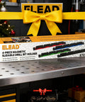 4 Piece Magnetic Slidable Drill Bit Holder With 160 Hole Storage box on workbench, yellow bow in background