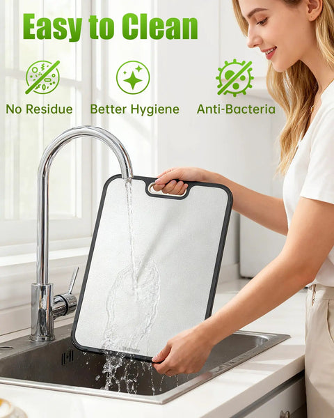 Woman cleaning Two Sided Non Toxic Cutting Board For Kitchen With Stainless Steel And BPA Free PP Surfaces 15.9 Inches Non Slip