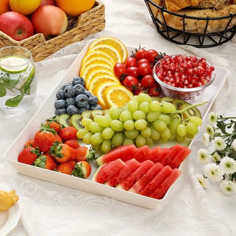 Four Pack Large White Serving Trays Set 16 By 11 Inch Food Grade BPA Free Plastic Platter with fruits on table
