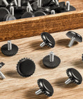 15 Pack 1/4 20 Adjustable Furniture Levelers Built From Heavy Duty Stainless Steel Screw In Feet displayed on a wooden surface.