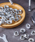 32 Piece Rock Solid Heavy Duty Stainless Steel Hex Flange Locking Nuts M10 X 1.25 Metric Fine Thread Rust Resistant on wooden plate
