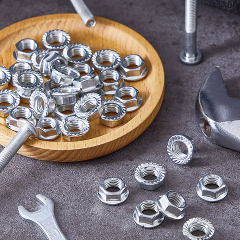 32 Piece Rock Solid Heavy Duty Stainless Steel Hex Flange Locking Nuts M10 X 1.25 Metric Fine Thread Rust Resistant on wooden plate