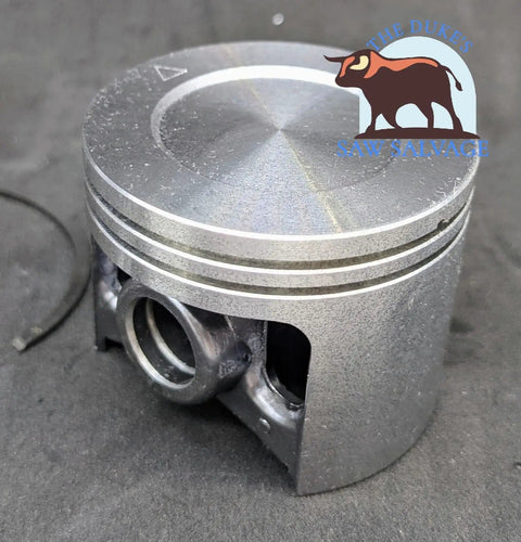 Heavy Duty Piston And Cylinder Kit Fits Hilti DSH 700 And DSH 700X Models With Nikasil Plated Cylinder Piston Set 412245 412238 Direct Replacement For Pros And DIYers showing a close-up of the piston component on a dark surface.