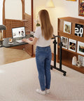 Super Adjustable Mobile Recliner Desk With Smooth Cruising Wheels Hella Flexible Overbed Table For Laptop Working, shown in use