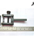 Spring Loaded Clamp Type Knurling Tool With Two Inch Capacity And Three Eighths Inch Shank For Lathes next to a ruler