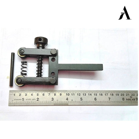Spring Loaded Clamp Type Knurling Tool With Two Inch Capacity And Three Eighths Inch Shank For Lathes next to a ruler