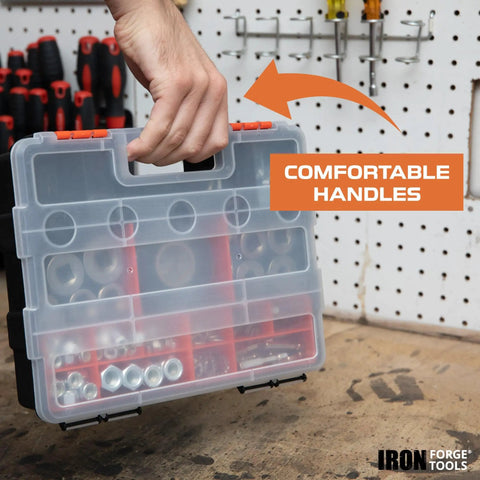 Person holding plastic tool organizer with clear lid and comfortable handles, displaying hardware compartments on workbench.