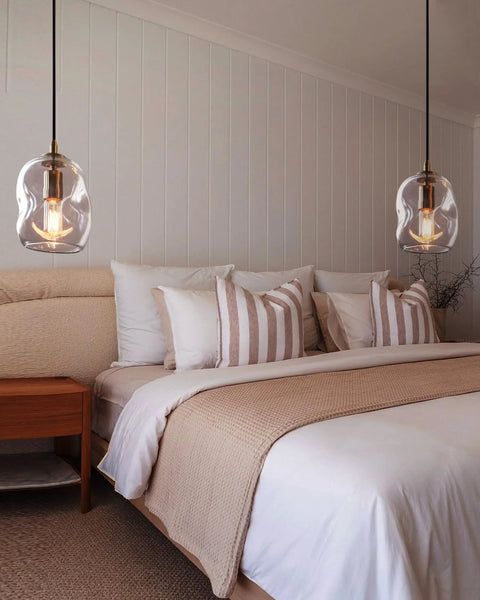 Dope Clear Art Glass Pendant Lights 2 Pack For Kitchen Island And Dining Room Table above a modern bed with soft linens.