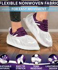 Person wearing Bulk Disposable Shoe Covers, 50 Pairs Per Box, Indoor Use Only, Thin Nonwoven Fabric, Stretch Fit Up To 15.7 Inches