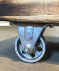 2-Inch Cast Iron Rigid Plate Caster with 1-1/4-Inch Wide and 2-Inch Diameter Silver Wheel attached to wood base
