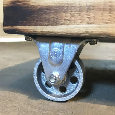2-Inch Cast Iron Rigid Plate Caster with 1-1/4-Inch Wide and 2-Inch Diameter Silver Wheel attached to wood base