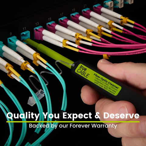 True CABLE fiber optic cleaner pen beside LC/MU 1.25mm connectors on a panel with turquoise cables