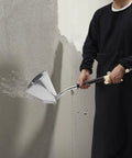 Heavy Duty Four Jet Pneumatic Cement Stucco Sprayer Gun with upward angle nozzle applying texture on wall.