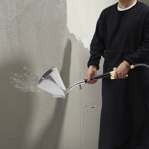 Heavy Duty Four Jet Pneumatic Cement Stucco Sprayer Gun with upward angle nozzle applying texture on wall.