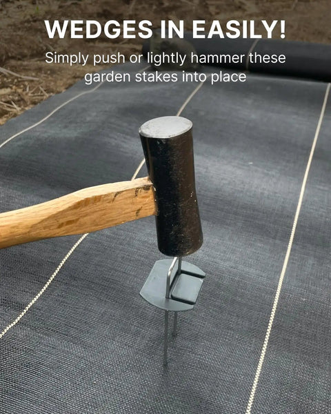Hammer installing Flip Washer Garden Stakes And Landscape Staples, 6 Inch Metal Yard Spikes for backyard landscaping on fabric