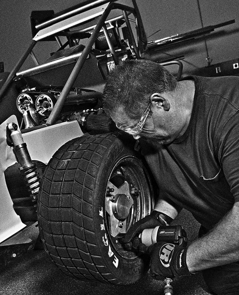 Mechanic using Heavy-Duty 1/2 Inch Composite Air Impact Wrench With Twin-Hammer Power on race car wheel