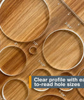 A Damn Sharp Transparent Acrylic Router Template For Woodworking Boasts Thirteen Circle Sizes with clear markings showing various diameters on wood.