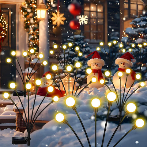 Solar Garden Lights Outdoor 4 Pack Firefly Swaying Lights Waterproof Garden Decor festive scene with snowman figures and warm glow.