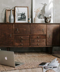 Wooden sideboard with Antique Brass Drop Pull Handles 4 Pack Featuring Ornate Pendant Drawer Knobs and décor items.
