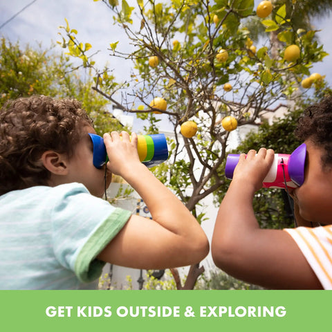 Kids using focus free binoculars for kids aged 4 to 8, lightweight and durable outdoor toy gear with neck strap, in the garden
