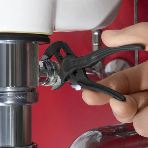 Mini Pliers Set XS In Belt Pouch Everyday Carry Tools with Cobra gripping a pipe under a sink, precision for tight spaces.