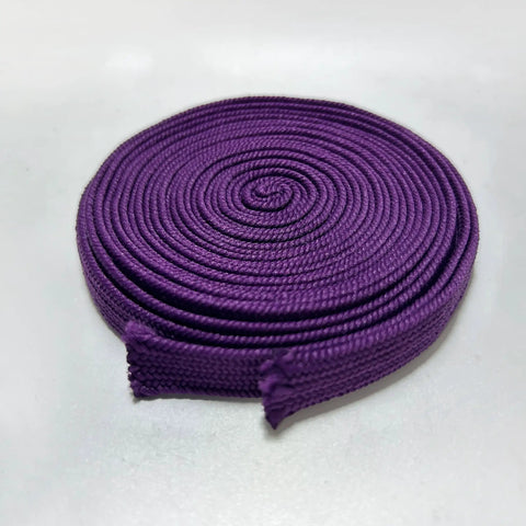 Close-up of coiled Purple Silk Sageo Ito Wrap Cord For Katana Wakizashi And Tanto Handles, Synthetic Silk Cotton 400cm 13ft Long