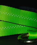Close-up of high-viz green webbing from 4 Pack 2 Inch By 8 Foot Car Tie Down Ratchet Straps With Chain Anchors, 3335 LBS WLL