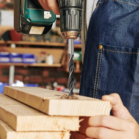 Person using drill with Eight Piece Wood Drill Bits Set Carbon Steel Brad Point Kit For Woodworking on wooden planks