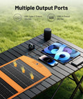 30W Portable Foldable Solar Panel Charger With USB A And USB C Fast Charging for iPhone and devices on outdoor table