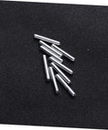 Close-up of 120pcs Robot Drive Shaft Kit For DIY Projects, metal shafts on black surface for RC cars and robots.