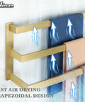 Gold three-tier towel bar with fast air drying trapezoidal design holding towels and arrows indicating airflow.