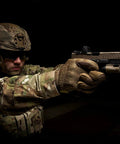 Original Tactical Glove With High Performance Anti Slip Grip For Real World Job Sites And Touchscreen Ready Safety Gear Impact Resistant Protection Medium Fit In Coyote Brown All Day Comfort And Flexible Cuff worn by armed person in action pose