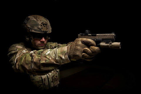 Original Tactical Glove With High Performance Anti Slip Grip For Real World Job Sites And Touchscreen Ready Safety Gear Impact Resistant Protection Medium Fit In Coyote Brown All Day Comfort And Flexible Cuff worn by armed person in action pose