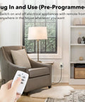 Living room with hand holding remote controlling Mini Wireless Remote Outlet Kit With One Remote And Three Outlets For Household Appliances