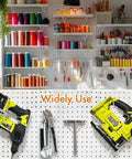 Craft room wall with pegboards and Heavy Duty Pegboard Hooks Kit Ten Pack Eight Inch Silver Pegboard Brackets organizing tools.
