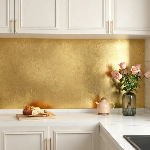 Dope Gold Peel And Stick Wallpaper Thick Metallic Wallcovering covering gold kitchen backsplash with flowers and bread.