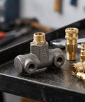 Four Way Pneumatic Air Compressor Manifold Mounting Bracket - Heavy Duty Cast Iron Construction on a workshop table