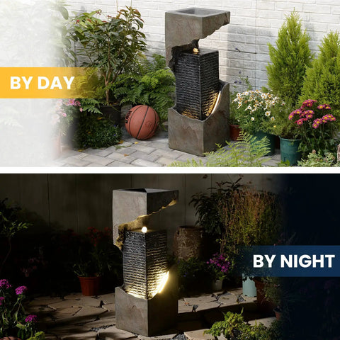 35.4 Inch Tall Indoor Outdoor Dope Waterfall Fountain With LED Lights in garden by day and illuminated at night