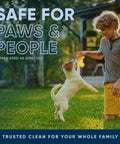 Boy playing with dog outdoors using safe for pets enzyme cleaner with sprayer, tackling odors on yards and patios eucalyptus scent