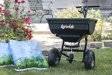 Pro Push Broadcast Spreader 85 Lb Capacity With Durable Plastic Hopper, Corrosion-Resistant And Made In USA beside grass seed bags
