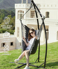 Woman relaxing on a dark gray hammock chair with stand for indoor and outdoor use, chill egg swing chair with patented adjustable pillow.