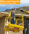 YINTATECH forklift safety cage, yellow 36x36-inch steel work platform with rails attached to a forklift boom, worker on roof.