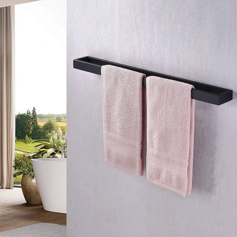 Matte Black 24 Inch Towel Bar Wall Mount For Bathrooms holding two towels in a modern bathroom by window