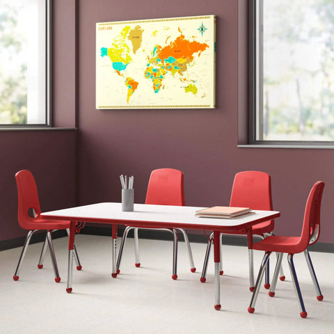 Classroom with a white table and red chairs, map of the world on the wall, neutral background, bright windows.