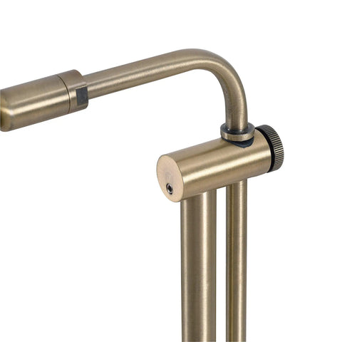 Close-up of Antique Brass Floor Lamp With Adjustable Height And Swivel Head, Classic Mid Century Modern Vibe, Contemporary Finish.