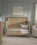 Bradford Toddler Bed Rail Conversion Kit for Full Size Cribs Pinewood Guard Rail in nursery setting.